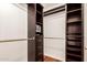 Organized walk-in closet with custom shelving and drawers, maximizing storage space at 17012 N 57Th St, Scottsdale, AZ 85254