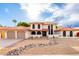 Charming two-story home with red tile roof, two-car garage and desert landscaping at 17012 N 57Th St, Scottsdale, AZ 85254