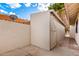 Exterior shot of the shed area features a neutral color scheme with a closed-door entrance at 17012 N 57Th St, Scottsdale, AZ 85254
