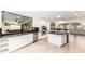 Spacious kitchen with white cabinets, stainless steel appliances, and a center island at 17012 N 57Th St, Scottsdale, AZ 85254