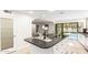 Kitchen island with granite countertops, stainless steel appliances, and pool view at 17012 N 57Th St, Scottsdale, AZ 85254