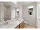 Bright bathroom featuring a double sink vanity, framed mirror and natural light at 17643 W Rancho Dr, Litchfield Park, AZ 85340