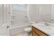 Full bathroom with shower over tub, toilet and wood vanity at 17643 W Rancho Dr, Litchfield Park, AZ 85340