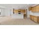 Bright kitchen with a large island, stainless steel appliances, and light wood cabinets at 17643 W Rancho Dr, Litchfield Park, AZ 85340