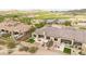 Scenic backyard with a manicured patio, stylish outdoor seating, and lush desert landscaping at 17913 W Sunward Dr, Goodyear, AZ 85338