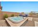 Enjoy the hot tub, set amongst beautiful landscaping and outdoor seating area at 17913 W Sunward Dr, Goodyear, AZ 85338