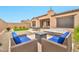The outdoor space includes comfortable seating, a fire pit, and a relaxing hot tub at 17913 W Sunward Dr, Goodyear, AZ 85338