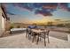 Backyard patio with a dining set, hot tub, and outdoor lounge area offers plenty of room for entertaining at 17913 W Sunward Dr, Goodyear, AZ 85338