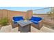 Cozy outdoor seating area with comfortable blue cushions and a stylish fire pit at 17913 W Sunward Dr, Goodyear, AZ 85338
