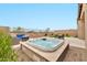 Relax in the spacious hot tub with a view of the outdoor seating and dining areas at 17913 W Sunward Dr, Goodyear, AZ 85338