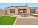 A covered patio, dining, spa and low-maintenance yard create an outdoor oasis at 17913 W Sunward Dr, Goodyear, AZ 85338