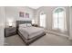 Bedroom features carpet floors, natural wood furnishings and plenty of natural light at 17913 W Sunward Dr, Goodyear, AZ 85338