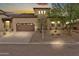 Charming single-Gathering home showcasing a desert-friendly landscaped front yard and a convenient two-car garage at 17913 W Sunward Dr, Goodyear, AZ 85338
