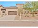 Inviting single-Gathering home displaying low-maintenance desert landscaping and an attached two-car garage at 17913 W Sunward Dr, Goodyear, AZ 85338