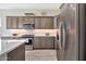 Well-equipped kitchen featuring stainless steel appliances, stylish cabinets, and ample counter space at 17913 W Sunward Dr, Goodyear, AZ 85338