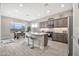 Bright and open kitchen featuring a central island, stainless steel appliances, and ample natural light at 17913 W Sunward Dr, Goodyear, AZ 85338