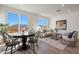Spacious living room area with modern decor and a sliding glass door to the backyard at 18072 W Sand Hills Dr, Surprise, AZ 85387