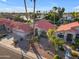 Stunning waterfront home featuring a tile roof, lush landscaping, and private boat dock at 186 N Starboard Dr, Gilbert, AZ 85234