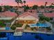 Stunning aerial view of a waterfront home featuring a pool, patio, and boat dock at 186 N Starboard Dr, Gilbert, AZ 85234