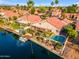 Beautiful aerial view of a waterfront home with a boat dock and swimming pool at 186 N Starboard Dr, Gilbert, AZ 85234