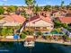 A beautiful home with lake access, a boat dock, and a sparkling pool in the landscaped backyard at 186 N Starboard Dr, Gilbert, AZ 85234