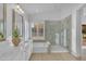 Bright bathroom with double sinks, separate shower, tub, and window with lots of natural light at 186 N Starboard Dr, Gilbert, AZ 85234