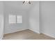 Bright bedroom features wood floors, a ceiling fan, and shuttered window at 186 N Starboard Dr, Gilbert, AZ 85234