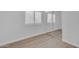Bright bedroom featuring a mirrored closet door and new hardwood flooring at 186 N Starboard Dr, Gilbert, AZ 85234