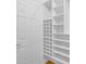 Walk in closet with white shelves and shoe racks at 186 N Starboard Dr, Gilbert, AZ 85234