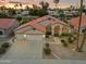 Beautiful home with a well-manicured front yard, three-car garage, and charming desert landscaping at 186 N Starboard Dr, Gilbert, AZ 85234