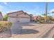 Spacious home with a three-car garage, and desert landscaping under a blue sky at 186 N Starboard Dr, Gilbert, AZ 85234