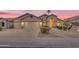 Charming home with a three-car garage, landscaped front yard, and a covered entryway, perfect for welcoming guests at 186 N Starboard Dr, Gilbert, AZ 85234