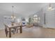 Bright living room and dining area featuring hardwood floors, vaulted ceilings, and lots of natural light at 186 N Starboard Dr, Gilbert, AZ 85234