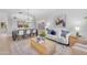 Open-concept living and dining area with hardwood floors, modern decor, and comfortable seating for entertaining guests at 186 N Starboard Dr, Gilbert, AZ 85234