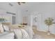 Bright main bedroom with high ceilings, an ensuite bathroom, and large window overlooking the pool at 186 N Starboard Dr, Gilbert, AZ 85234