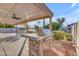 Outdoor kitchen featuring a granite countertop and stainless steel grill, with a view of the canal at 186 N Starboard Dr, Gilbert, AZ 85234