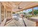 Spacious covered patio with ceiling fans overlooking the pool, hot tub, and waterway at 186 N Starboard Dr, Gilbert, AZ 85234