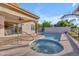Beautiful pool and spa with a covered patio and views of the lush landscaping at 186 N Starboard Dr, Gilbert, AZ 85234