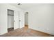 Bright bedroom featuring neutral carpet, white walls, closet, and white doors at 1918 E Anchor Dr, Gilbert, AZ 85234