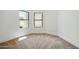 Bedroom featuring plush carpeting and two windows, providing a blank canvas at 1918 E Anchor Dr, Gilbert, AZ 85234