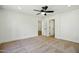 Spacious carpeted bedroom with contemporary ceiling fan and white trim at 1918 E Anchor Dr, Gilbert, AZ 85234