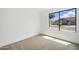 An empty bedroom with plush carpeting, lots of light, and neutral paint, providing a blank canvas at 1918 E Anchor Dr, Gilbert, AZ 85234