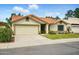 Charming single-story home with a terracotta tile roof and an attached two-car garage at 1918 E Anchor Dr, Gilbert, AZ 85234