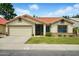 Charming single-story home with a well-maintained lawn, mature shrubs, and a two-car garage at 1918 E Anchor Dr, Gilbert, AZ 85234