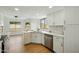 Bright kitchen featuring white cabinets, stainless appliances, and views to backyard at 1918 E Anchor Dr, Gilbert, AZ 85234