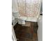 Clean bathroom featuring a standard toilet, shower/tub combo, and rustic tile flooring at 19601 N 7Th N St # 1032, Phoenix, AZ 85024