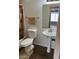 Bathroom with pedestal sink, toilet, and shower featuring modern fixtures at 19601 N 7Th N St # 1032, Phoenix, AZ 85024