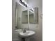 Well-lit bathroom with modern fixtures and a stylish pedestal sink at 19601 N 7Th N St # 1032, Phoenix, AZ 85024