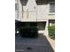 Close-up view of a townhome exterior with a balcony and greenery, offering a private entrance at 19601 N 7Th N St # 1032, Phoenix, AZ 85024