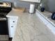 Bright kitchen counter with updated features, including marble countertops and modern appliances at 19601 N 7Th N St # 1032, Phoenix, AZ 85024